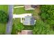 Aerial view of a well-maintained home featuring a long driveway and lush trees at 3405 E Jameson Rd, Raleigh, NC 27604