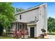 A delightful view of the home's exterior features a screened in porch, and well maintained siding and backyard at 3405 E Jameson Rd, Raleigh, NC 27604