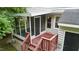 Screened-in back porch with wood deck, providing an ideal space for outdoor relaxation at 3405 E Jameson Rd, Raleigh, NC 27604