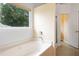 Bright bathroom featuring a soaking tub under a window with natural light at 3405 E Jameson Rd, Raleigh, NC 27604