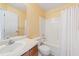This bathroom features a clean, bright space with white fixtures and a wood vanity at 3405 E Jameson Rd, Raleigh, NC 27604