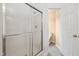 Bathroom with glass-door shower and toilet at 3405 E Jameson Rd, Raleigh, NC 27604