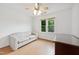 Bedroom featuring neutral walls, light wood flooring, a sofa, and a dresser at 3405 E Jameson Rd, Raleigh, NC 27604