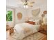Bright bedroom with a queen bed, stylish decor, natural light, and a cozy, inviting feel at 3405 E Jameson Rd, Raleigh, NC 27604