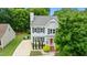 Charming two-story home features a beautifully landscaped yard, driveway and inviting curb appeal at 3405 E Jameson Rd, Raleigh, NC 27604