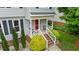 Charming front porch with decorative railings, creating a welcoming entrance to the home at 3405 E Jameson Rd, Raleigh, NC 27604