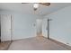 Simple bedroom with light blue walls, white trim, and ceiling fan for a cozy atmosphere at 345 Henderson St, Oxford, NC 27565