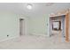 Neutral bedroom featuring soft carpet, a doorway, and mint-green walls at 345 Henderson St, Oxford, NC 27565