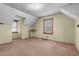 Attic bedroom featuring hardwood floors, and a window with natural light at 345 Henderson St, Oxford, NC 27565