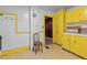 Additional view of kitchen highlighting cabinets, chair, and the room's layout and fixtures at 345 Henderson St, Oxford, NC 27565