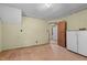 A room with hardwood floors, light-yellow walls, and an open doorway at 345 Henderson St, Oxford, NC 27565