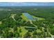 Lake with an island and access road at 390 Lake Magnolia Way, Smithfield, NC 27577