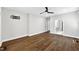 Empty bedroom with a ceiling fan, hardwood floors, and an ensuite bathroom at 390 Lake Magnolia Way, Smithfield, NC 27577