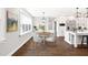 Dining room with hardwood floors and natural light offers a cozy and inviting space for meals at 390 Lake Magnolia Way, Smithfield, NC 27577
