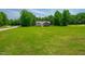 Beautiful lake house with expansive lawn and mature trees at 390 Lake Magnolia Way, Smithfield, NC 27577