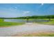 Lawn leading to lake with boat ramp at 390 Lake Magnolia Way, Smithfield, NC 27577