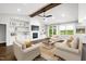 Inviting living room with fireplace and built-ins, with view to back deck at 390 Lake Magnolia Way, Smithfield, NC 27577