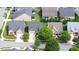 Desirable homes with verdant landscaping and mature trees exemplify a tranquil residential area, ideal for peaceful living at 4110 Argyle Trl, Burlington, NC 27215