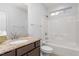 This bathroom includes a granite countertop next to a toilet in a tub with a shower head at 4110 Argyle Trl, Burlington, NC 27215