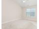This bedroom features natural light coming in from the window, highlighting the beige carpet throughout the room at 4110 Argyle Trl, Burlington, NC 27215