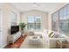 Bright living room with a comfortable sectional sofa, large windows, and natural light at 4110 Argyle Trl, Burlington, NC 27215