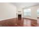 Bright living room featuring hardwood floors, a fireplace, and plenty of natural light at 4110 Argyle Trl, Burlington, NC 27215