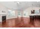 Open-concept living area featuring hardwood floors, a fireplace, and plenty of natural light at 4110 Argyle Trl, Burlington, NC 27215