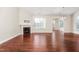 Empty living room showcasing hardwood floors, a fireplace, and bright natural light at 4110 Argyle Trl, Burlington, NC 27215