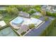 A beautiful community pool with a separate kiddie pool, ample parking, and clubhouse create an attractive aerial view at 4110 Argyle Trl, Burlington, NC 27215