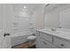 Well-lit bathroom with a shower-tub combo, modern vanity and stylish fixtures at 432 Golden Dragonfly St, Wake Forest, NC 27587