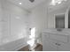 Bright bathroom with a tub and shower combination, and a single sink vanity at 432 Golden Dragonfly St, Wake Forest, NC 27587