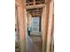 Unfinished bathroom view shows prepped shower base, plumbing, and exposed beams and wiring at 432 Golden Dragonfly St, Wake Forest, NC 27587