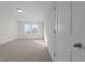 Bright bedroom with plush carpet, natural light from the window, and white trim at 432 Golden Dragonfly St, Wake Forest, NC 27587