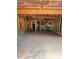 Unfinished two-car garage with exposed rafters shows the internal framing, a stairwell, and access to the house at 432 Golden Dragonfly St, Wake Forest, NC 27587