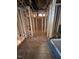 A view of the unfinished hallway, showing the doorway placements and plumbing to the bathrooms at 432 Golden Dragonfly St, Wake Forest, NC 27587