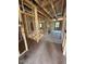 A view of the unfinished hallway, showing the staircase and framing of rooms under construction at 432 Golden Dragonfly St, Wake Forest, NC 27587