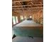 Unfinished living room showcases open layout, fireplace, exposed ceiling beams, and glass doors leading to the outdoors at 432 Golden Dragonfly St, Wake Forest, NC 27587