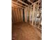 A view of the unfinished room with wooden frames and showing the doorway placements to other rooms at 432 Golden Dragonfly St, Wake Forest, NC 27587