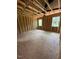 A view of the unfinished room with wooden frames and the placement of windows overlooking the landscape at 432 Golden Dragonfly St, Wake Forest, NC 27587