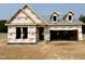 Exterior view of a home under construction with a two-car garage and covered entrance at 455 Beacon Hill Rd # 28, Lillington, NC 27546