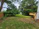 Backyard featuring a large grassy area and a deck at 4903 Bridgewood Dr, Durham, NC 27713