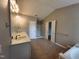 Bathroom featuring double vanity, tile floor, bathtub, and glass-enclosed shower at 4903 Bridgewood Dr, Durham, NC 27713