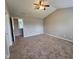 Large bedroom with vaulted ceiling, ceiling fan, and neutral carpet at 4903 Bridgewood Dr, Durham, NC 27713