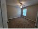 Inviting bedroom featuring a ceiling fan and natural light from the window at 4903 Bridgewood Dr, Durham, NC 27713