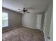 Bedroom with a ceiling fan, closet, and bright window for ample natural light at 4903 Bridgewood Dr, Durham, NC 27713