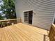 New wood deck offers an extension of the living space, with sliding glass door access to the home at 4903 Bridgewood Dr, Durham, NC 27713