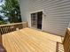 Spacious wooden deck featuring railing with a sliding glass door into the home at 4903 Bridgewood Dr, Durham, NC 27713