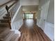 Inviting entryway with wood-look flooring and a staircase leading to the upper level of the home at 4903 Bridgewood Dr, Durham, NC 27713
