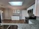 Bright kitchen with granite counters, a skylight, and stainless steel appliances at 4903 Bridgewood Dr, Durham, NC 27713