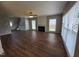 Open concept living room with wood-look floors, bright windows, and a cozy fireplace as the focal point at 4903 Bridgewood Dr, Durham, NC 27713